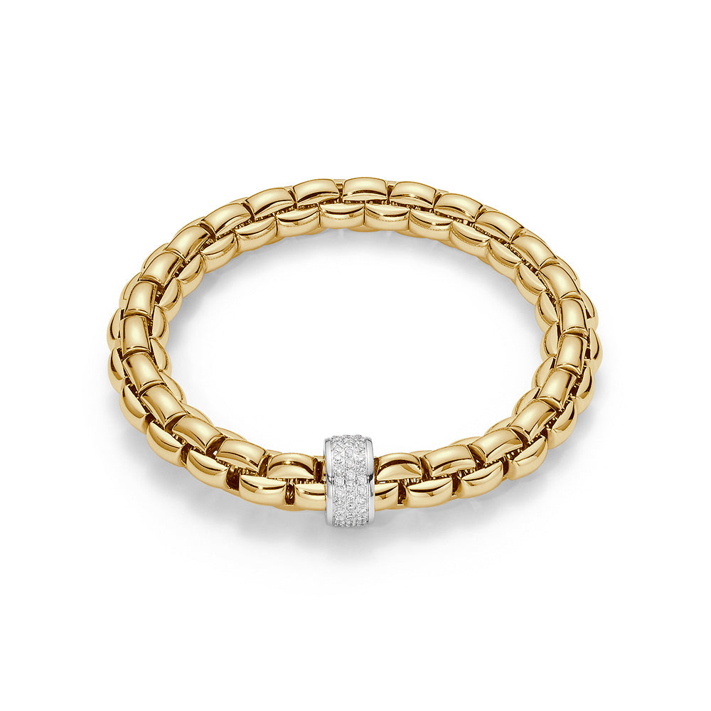  Flexible bracelet entirely made of 18 carat yellow gold with 0.63ct of diamonds pave set in white gold rondel. Each Fope jewel is hand crafted in Vicenza, Italy to the finest Italian standards