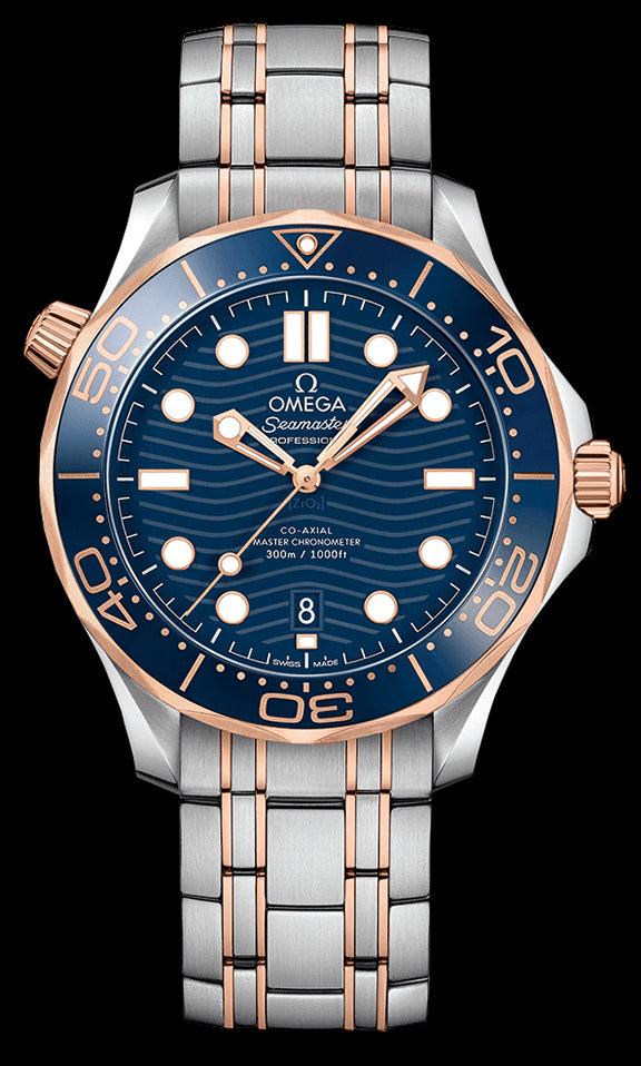 42mm This watch has a stainless steel case with a blue ceramic and 18kt Sedna™ gold rotating bezel. There is a blue ceramic dial under the domed sapphire crystal. The dial features a modern update to the laser engraved wave pattern made iconic by the original Diver 300m in 1993. The 18kt Sedna™ gold skeleton hands and hour markers are rhodium plated and filled with Super-LumiNova. The date can be viewed at the 6 o’clock position.