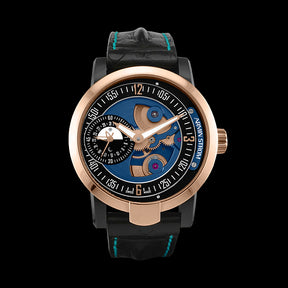  This watch has a steel PVD and gold case with a sapphire crystal over the dial.  The dial ring is black with gold founded applique indexes.  The base plate of this piece is blue with a small seconds subdial at the 9 o’clock position.  The subdial also features a date and a day/night indicator.  This watch is powered by the ADD14 automatic movement with a micro rotor that can be seen through the dial plate.