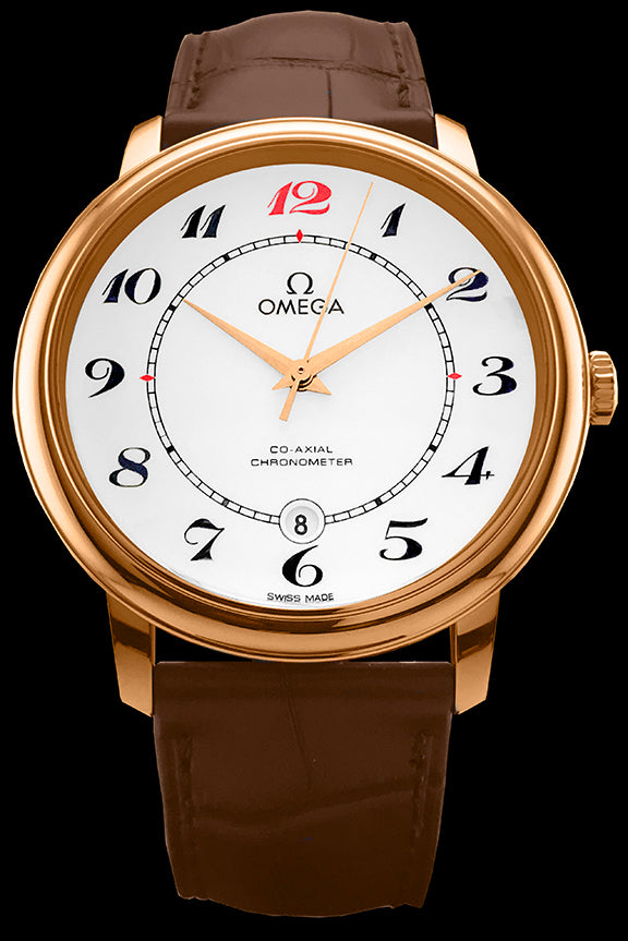  39.5mm- This watch has an 18kt red gold case with a domed sapphire crystal over the white enamel dial. The date can be viewed at the 6 o’clock position. The hands are gold toned. This watch features the Omega 2500 Co-Axial calibre movement. It comes on a brown leather strap with an 18kt gold tang buckle and is water resistant to 30 meters.
