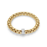 Flexible bracelet entirely made of 18 carat yellow gold with 0.63ct of diamonds pave set in white gold rondel. Each Fope jewel is hand crafted in Vicenza, Italy to the finest Italian standards