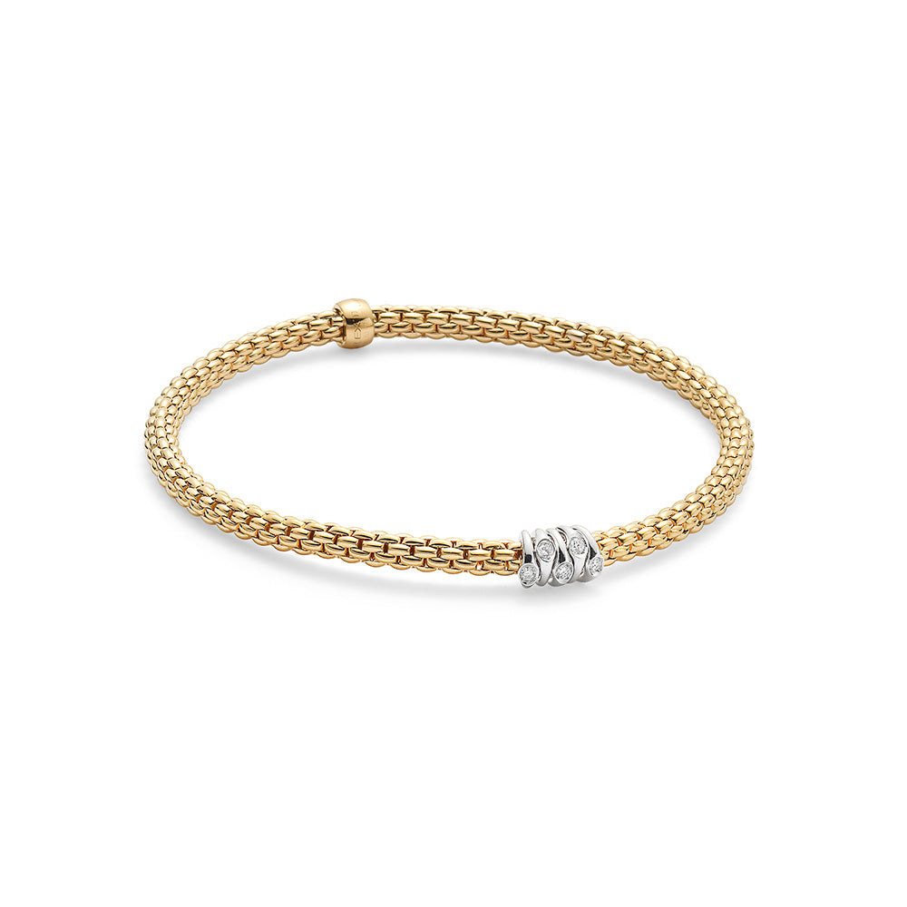 Flexible bracelet entirely made of 18 carat yellow gold with 0.07ct of diamonds set in white gold. ( Size M )