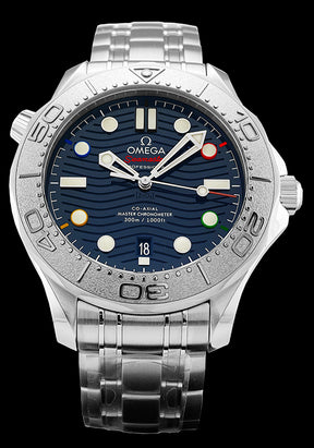  42mm- This watch has a stainless steel case with a grade 5 titanium bezel ring. There is a sapphire crystal over the blue ceramic dial. The sun-brushed dial also features laser engraved waves and luminescent hands and indexes. As a special tribute to Beijing 2022, there are also five special minute-markers at 2H, 4H, 8H, 10H and 12H, with each one created in the five colors of the iconic Olympic Rings. There is also a date display at the 6 o’clock position. 